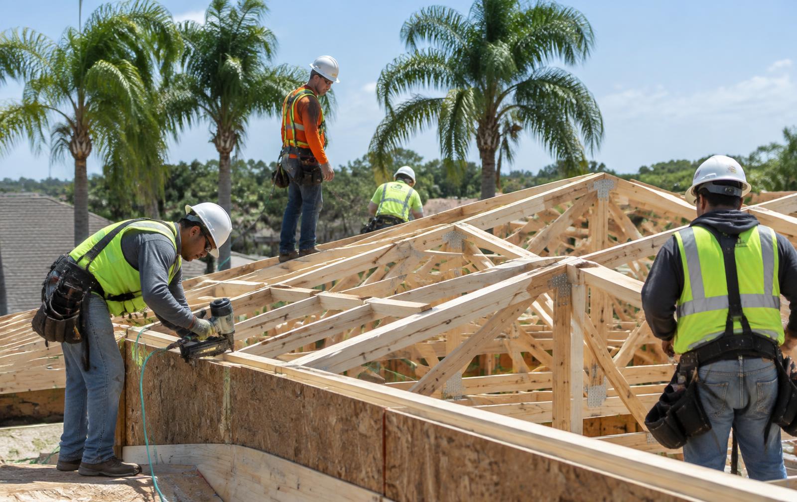 Central Florida construction crew framing a roof on a job site