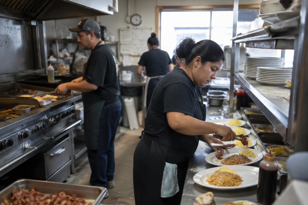 Cooks working the line in a local Florida restaurant kitchen